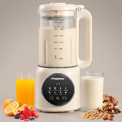 Cream-colored nut milk maker machine with a glass of milk, orange juice, nuts and fruit