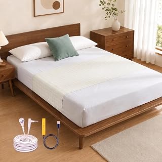 White grounding mat laid on top of a bed, with the grounding cord and plug shown in front